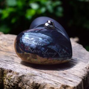 Heart shaped urn black with oily color with silver heart