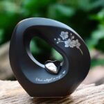 Infinity urn in black color with silver heart