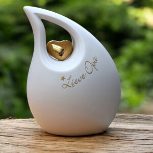 Slanted tear urn in white color with gold heart