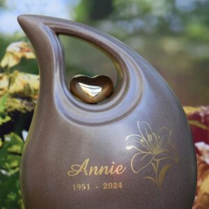 slanted tear urn in brown color with image of lily flower and a name