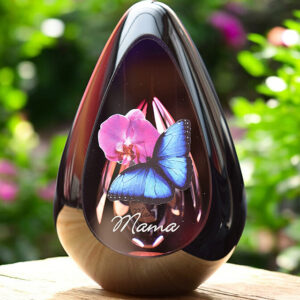 Design urn made of glass with pink ash chamber and image of a pink orchid and blue butterfly with space for a short name – suitable for cremation ashes.