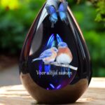 Glass design urn with blue ash chamber and image of two birds with the text Together forever – suitable for cremation ashes.