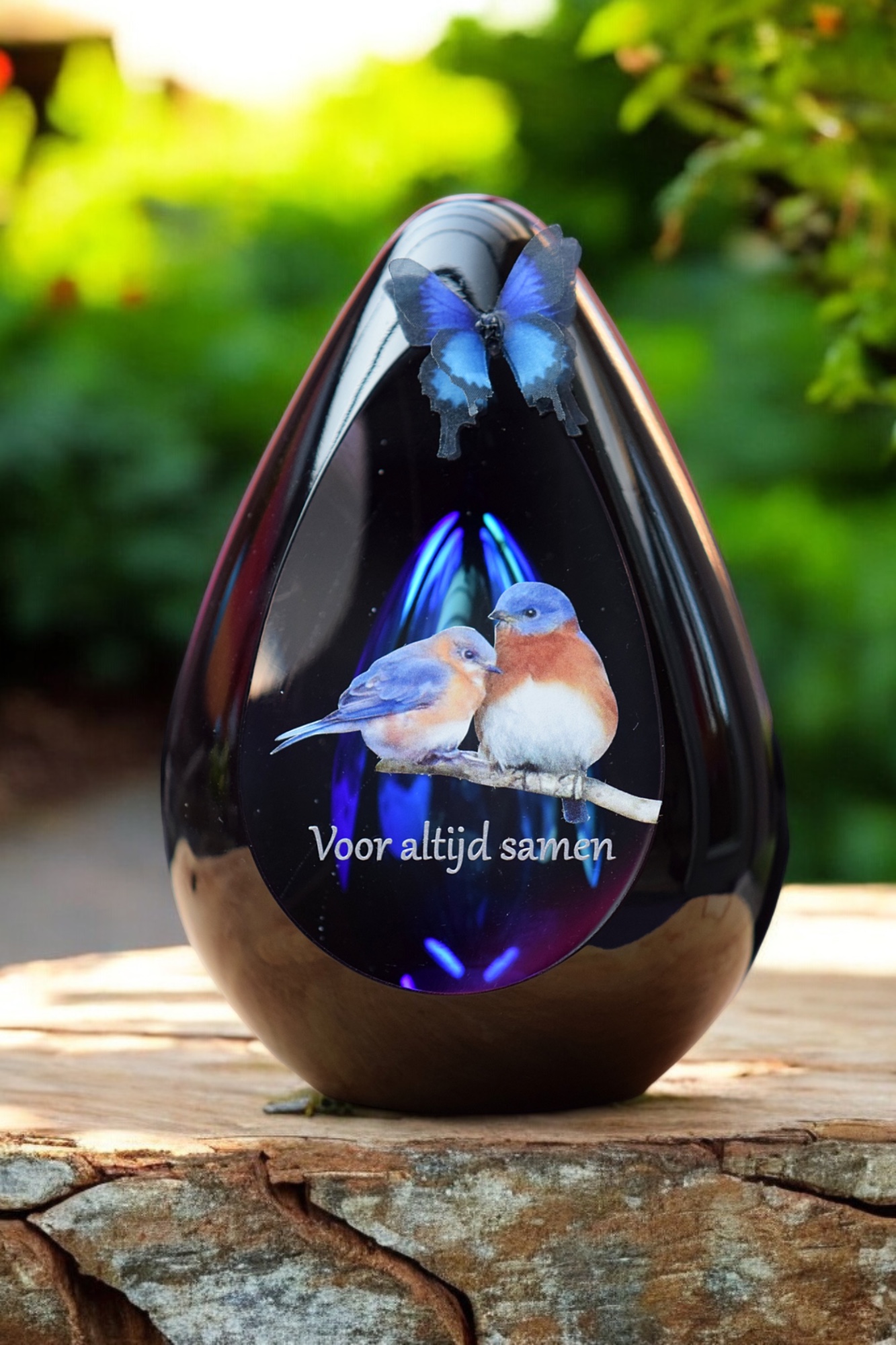 Glass design urn with blue ash chamber and image of two birds with the text Together forever – suitable for cremation ashes.