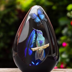 Design glass urn with blue ash chamber and image of a hummingbird – suitable for cremation ashes.
