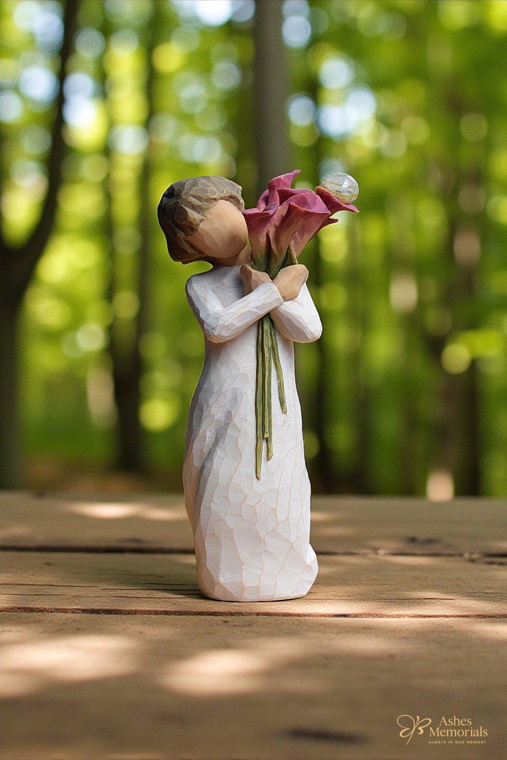 Willow Tree figurine Bloom with woman in white dress holding red calla lilies close to her