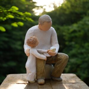 Willow Tree figurine Grandfather and Grandchild man embracing child while holding mini urn for ashes or a lock of hair