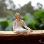 Willow Tree figurine Thoughtful Child seated child in quiet pose with mini urn for ashes or a lock of hair