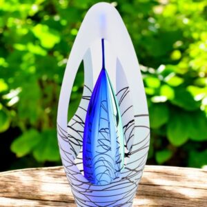 Design urn made of glass with transparent blue ash chamber