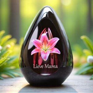 Design urn made of glass with transparent pink ash chamber and image of a pink lily – suitable for storing cremation ashes.