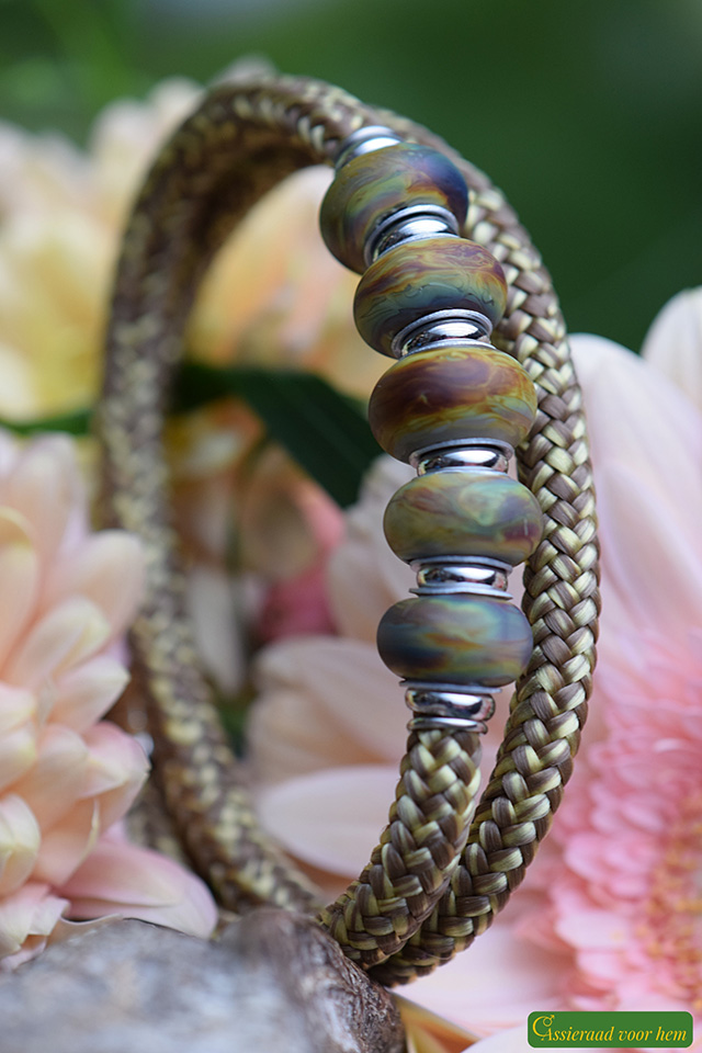 Vertical view of brown-yellow men’s bracelet with ashes in matte glass bead