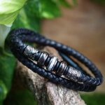 Double braided black leather men’s memorial bracelet with three keepsake beads and silver steel design accents.