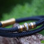 Black sailrope men’s memorial bracelet with ashes in gold bead