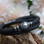 Black double men’s sailrope bracelet with silver stainless-steel details and glass bead with ashes.