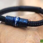 Front view of black sailrope men’s memorial bracelet with ashes in central stainless-steel bead.