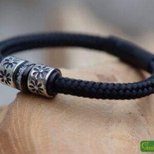 Men’s memorial bracelet in black sailrope with cremation ashes in stainless-steel bead and black clasp.