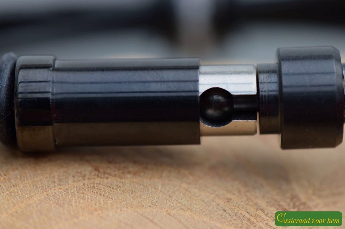 Detail of black stainless-steel cup-and-cone slide clasp with spring system on men’s memorial bracelet.