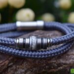 Grey sailrope men’s memorial bracelet with ashes set in central stainless-steel bead.