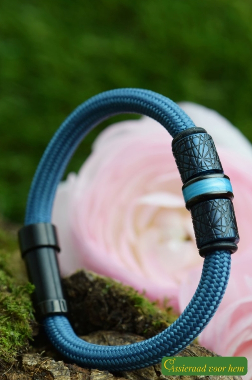 Vertical photo of petrol men’s memorial bracelet with ashes in stainless-steel bead.