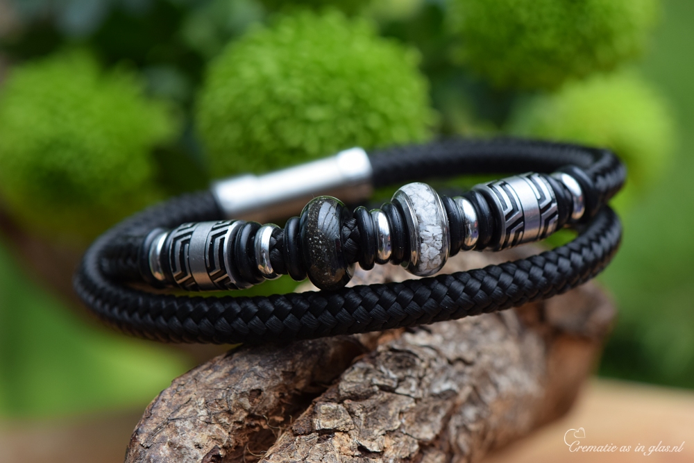 Black double sailrope bracelet with silver-tone design beads and two stainless-steel beads containing ashes.