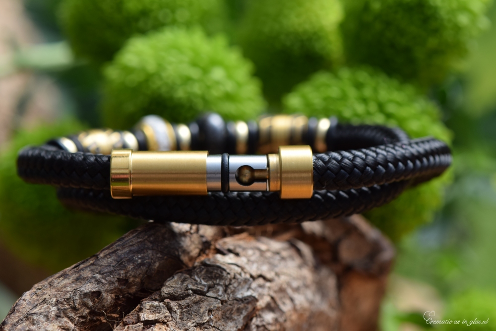 Close-up of gold and black stainless-steel beads with ashes on double sailrope men’s memorial bracelet.