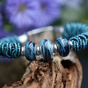 Men’s memorial bracelet with turquoise-black knotted band and three petrol-black glass beads