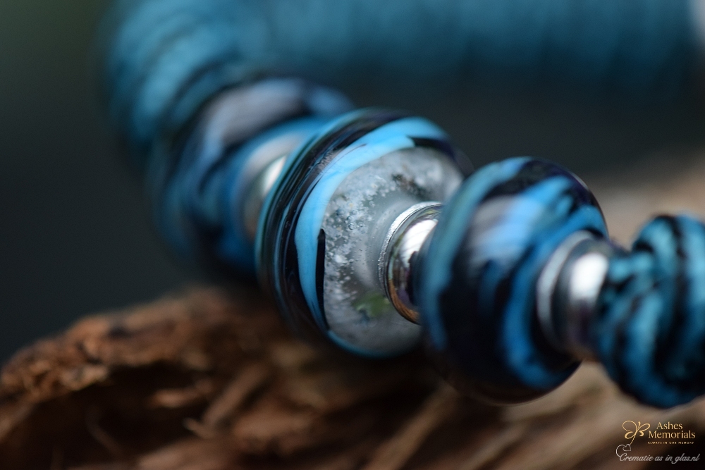 the centre bead containing cremation ashes.