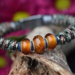 Men’s memorial bracelet with woodland camo knotwork and three transparent amber glass beads