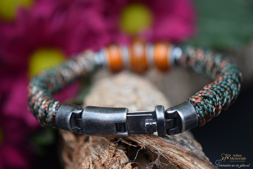 Men’s memorial bracelet with close-up of three transparent amber glass beads