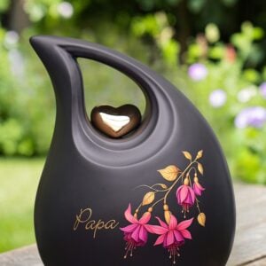 Black ceramic memorial urn 3.8 liter with golden heart, pink fuchsia flower and personalized gold foil name.