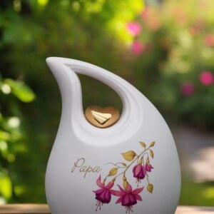 White ceramic memorial urn 2.2 liter with golden heart, pink fuchsia flower and personalized name in gold foil.